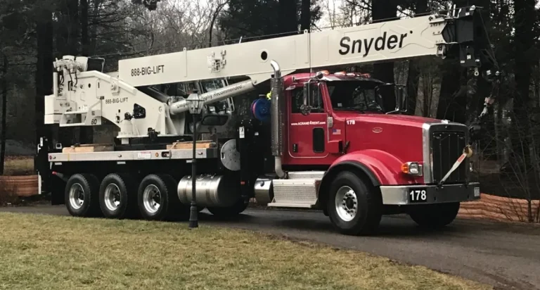 DJ Snyder's red Peterbilt crane truck 178 with its white 888-BIG-LIFT boom folded down
