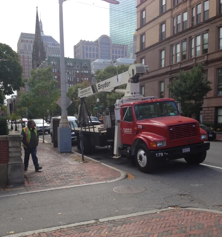 DJ Snyder crane truck 179 set up on a Boston street with city buildings behind