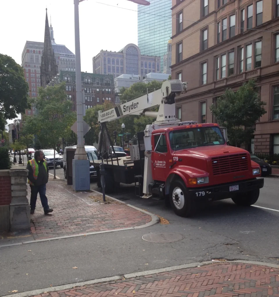 DJ Snyder crane truck 179 set up on a Boston street with city buildings behind